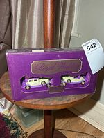 Front view of sealed box showing both die-cast cars