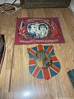 Flag and cardboard shield on floor