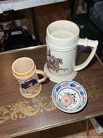 Overview of both steins and bowl on table