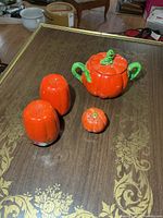 Group view of two tall shakers, small shaker, and lidded condiment dish