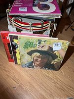 Front view of stack showing John Denver’s Greatest Hits jacket plus additional albums behind