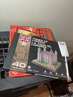 Tower of London 3D puzzle box atop Davy Crockett puzzle box