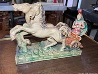 Full sculpture showing horses and gladiator in chariot