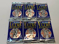 Six unopened Fleer Ultra '91 Baseball card packs arranged in two rows