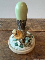 Front view of cookie stamp showing sculpted robin, nest, eggs