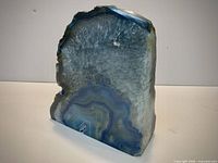 Front angled view showing polished face, crystalline interior and rough edges