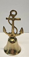 Front view of brass bell showing anchor handle and bell body
