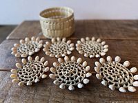All six coasters and basket displayed on table