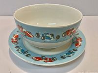Bowl nested on saucer showing race car design