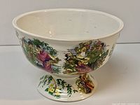 Oblique view showing exterior decoration and pedestal