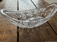 Side view of oval clear crystal cut glass bowl showing star and fan cut pattern