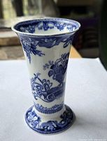 Front view of blue and white bone china bud vase