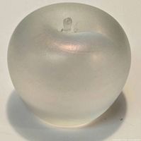Front view of frosted glass apple paperweight showing shape and stem