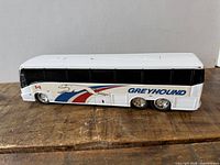 Right side view of Greyhound coach toy bus