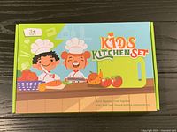 Front of sealed Kids Kitchen Set box showing graphics and age 3+