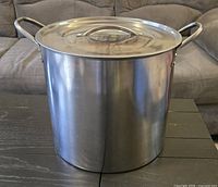 Front view of stainless stock pot with lid in place