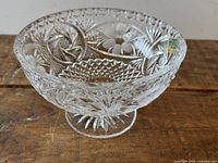 Oblique view of footed compote showing floral and diamond cuts