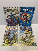 Group shot of all four New Mutants issues in sleeves