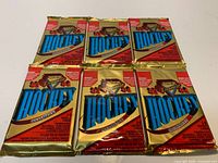 Six gold foil 1993-94 O-Pee-Chee Premier Series II hockey card packs laid out