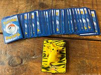 Stack of card backs and Pikachu viewer front