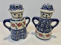 Front view of both ceramic figurine shakers