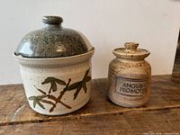 Front view of crock with darker lid and Angus Promoter jar