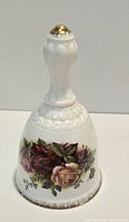 Full view of Royal Albert bone china bell front floral design and handle