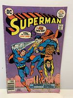 Front cover of Superman #306 comic book showing artwork, price, date and visible wear