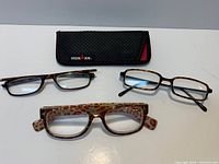Three reading glasses and Ironman case overview