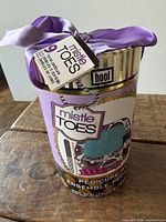 Front view of sealed Hoof Mistle Toes pedicure pail with ribbon