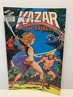 Ka-Zar the Savage comic book cover showing Shanna with sword and Ka-Zar leaping