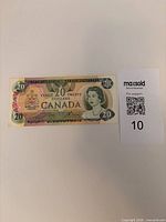 Full view of Canadian $20 note with QR tag