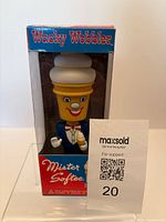 Front view of Funko Mister Softee Wacky Wobbler in box with reference card