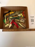 Top view of box containing mixed fishing lures