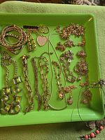 Full tray showing entire assortment of necklaces, bracelets, brooches and earrings