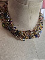 Front view on bust showing multistrand arrangement and bead variety