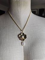 Necklace on mannequin showing full drop and pendant