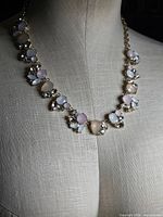 Full view of necklace on mannequin showing overall design