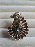 Frontal view of peacock ring showing stone layout and shape