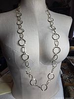 Necklace displayed full length on mannequin showing link style
