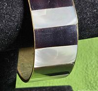 Full view of bracelet showing alternating inlays