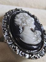 Front view showing cameo detail and ornate bezel