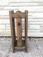Full front view of wooden umbrella stand
