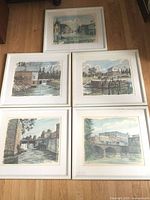 All five framed prints laid out on floor
