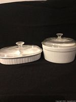 Both casserole dishes with lids displayed closed