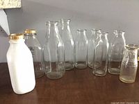 Group view of all nine bottles on tabletop