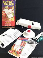 Full set with mandoline, inserts, hand guard, juicer, manual, box