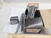 Open box showing carriage bolts and small box of nuts