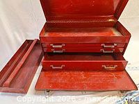 Toolbox open showing three drawers and removable tray