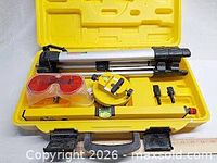 Entire kit in yellow case showing tripod, laser level, torpedo level, goggles, adapters